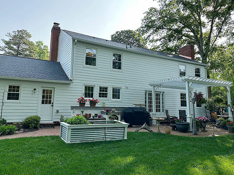 Residential Exterior of siding, gutters, roof, and pergola